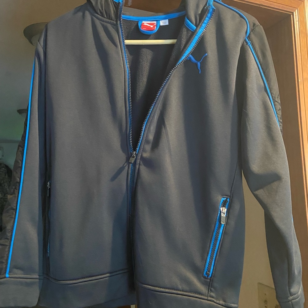 Puma fleece jacket boys medium. Brand new no tags. Black, details blue